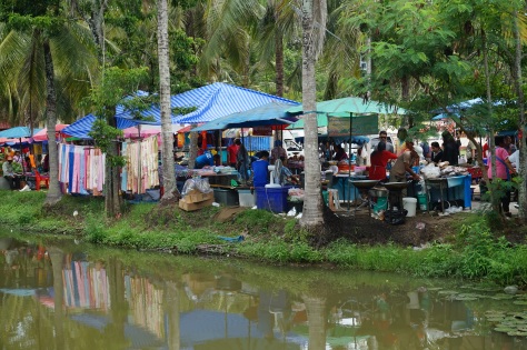 Some of the clothing and food stalls of the weekly market