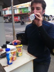 Mike eating our "Ramadan breakfast"- yogurt and cup of noodles from 7/11.