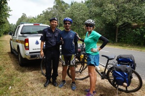 Cheesin' with the Malaysian cop who pulled us over for the photo op! 